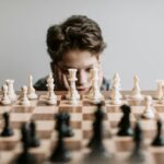 a boy playing chess